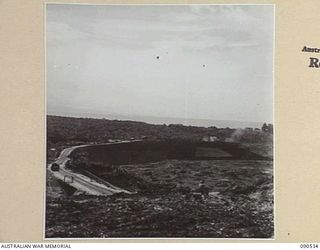 JACQUINOT BAY, NEW BRITAIN. 1945-04-13. LOOKING DOWN FROM THE END OF THE AIRSTRIP ONTO THE NEW FARM WHICH IS BEING LAID OUT BY 2 INDEPENDENT FARM PLATOON. THE OBJECT IS TO SUPPLY HOSPITALS AND ..
