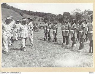 NADZAB, NEW GUINEA. 1945-10-25. GENERAL SIR THOMAS A. BLAMEY, COMMANDER-IN-CHIEF, ALLIED LAND FORCES, SOUTH WEST PACIFIC AREA, INSPECTING NATIVE TROOPS OF THE NEW GUINEA INFANTRY BATTALION, PACIFIC ..