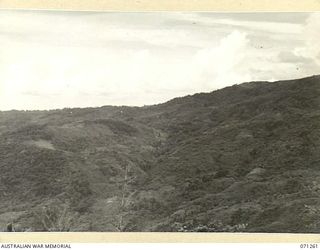 FINSCHHAFEN AREA, NEW GUINEA. 1944-03-18. ONE OF THREE PHOTOGRAPHS FORMING A PANORAMA OF SATTELBERG VIEWED FROM KUANKO. (JOINS WITH NOS. 71260 AND 71262)