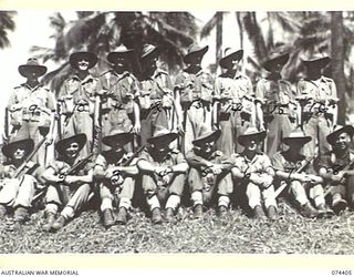 MADANG, NEW GUINEA. 1944-06-30. PERSONNEL OF COMPANY HEADQUARTERS, D COMPANY, 24TH INFANTRY BATTALION. IDENTIFIED PERSONNEL ARE:- VX139868 CORPORAL R.H. PAGE (1); NX106317 PRIVATE W.C. GOODWIN (2); ..