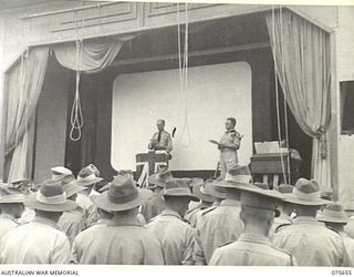 LAE, NEW GUINEA. 1944-09-03. NX156703 CHAPLAIN R.S. PICKUP, MC, ED, DEPUTY ASSISTANT CHAPLAIN GENERAL UNITED CHURCHES (LEFT) ASSISTED BY VX65607 CHAPLAIN L. CULA CHURCH-OF-ENGLAND (RIGHT) ..