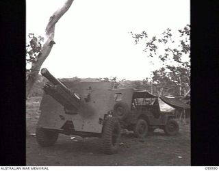 PORT MORESBY, NEW GUINEA. 1943-11-15. A "NORMAL" 25-POUNDER GUN OF THE 2/5TH AUSTRALIAN FIELD REGIMENT HITCHED TO A JEEP AND READY FOR THE ROAD