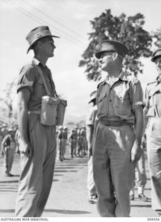 LAE AREA, NEW GUINEA, 1945-08-05. BRIGADIER P.S. MCGRATH, DEPUTY DIRECTOR OF SUPPLIES AND TRANSPORT (2), DURING HIS INSPECTION OF HEADQUARTERS COMPANY, 1 PLATOON, 151 GENERAL TRANSPORT COMPANY, ..