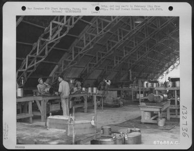 Aluminum is treated in the heat treating department of the 27th Air Depot Group at the Port Moresby Air Depot, Papua, New Guinea. 1943. (U.S. Air Force Number 67688AC)