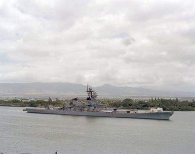 Crew members man the rail as the battleship USS NEW JERSEY (BB 62) passes the ARIZONA Memorial