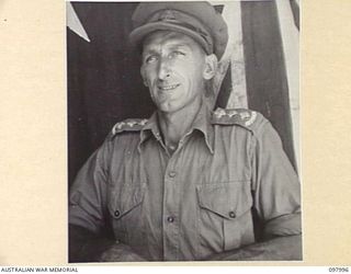 CAPE WOM, WEWAK AREA, NEW GUINEA. 1945-10-17. CAPTAIN J.F. SLADE, PAYMASTER, HEADQUARTERS 6 DIVISION