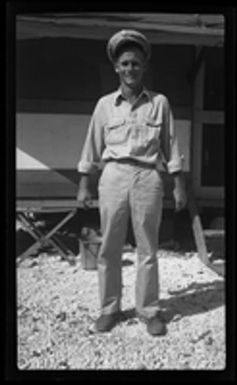 [Serviceman in front of building]