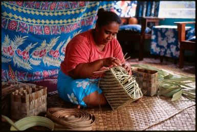 Woman weaving a pandanus basket, Samoa