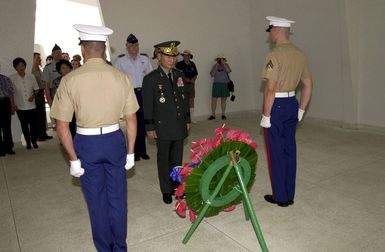 General Cho, Yung Kil (Center), Chairman, Joint Chiefs of STAFF, Republic of Korea, prepares for a wreath laying ceremony at USS Arizona Memorial at Pearl Harbor, Hawaii, on October 30th, 2000. The ceremony honored the 1,177 Sailors and Marines who lost their lives during the 1941 attack on Pearl Harbor. GEN Cho is in Hawaii this week attending the Chiefs of Defense Conference