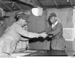 TOROKINA, BOUGAINVILLE. 1945-09-08. LIEUTENANT-GENERAL (LT-GEN) S. G. SAVIGE, GENERAL OFFICER COMMANDING 2 CORPS, ACCEPTED THE SURRENDER OF ALL JAPANESE FORCES ON BOUGAINVILLE FROM LT-GEN M. KANDA, ..