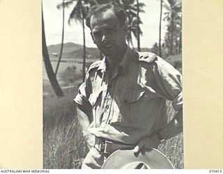 PORT MORESBY, PAPUA, NEW GUINEA, 1944-02-14. CAPTAIN ROBIN WOOD, THE STATION SUPERVISOR AND OFFICER- IN- CHARGE OF "9PA" AUSTRALIAN BROADCASTING COMMISSION BROADCASTING STATION