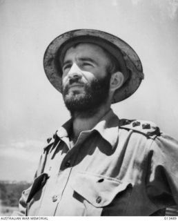 1942-11-06. CAPT. S. BUCKLER OF COFFS HARBOUR, N.S.W., 23 YEAR OLD LEADER OF A VICTORIAN INFANTRY COMPANY OF THE A.I.F., PHOTOGRAPHED ON HIS RETURN TO MORESBY AFTER MANY WEEKS SPEND BEHIND THE ..