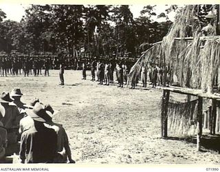 LAE, NEW GUINEA. 1944-04-02. MEMBERS OF THE 47TH INFANTRY BATTALION ON PARADE DURING THE PRESENTATION OF MEDALS TO MEMBERS OF THE ROYAL PAPUAN CONSTABULARY BY MAJOR GENERAL B.M. MORRIS, DSO, ..