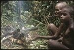 Mamaniageni and old Boori'au cooking in some bamboos