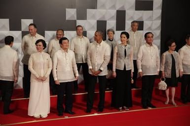 Barack Obama joins Asia Pacific Economic Cooperation Summit leaders and spouses for a group photo in Pasay, Metro Manila, Philippines, November 18, 2015