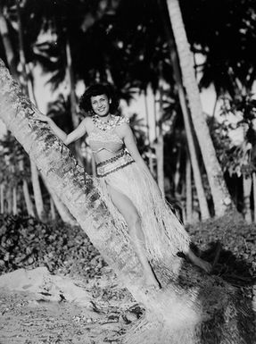 [Portrait of a woman in a bark dress and fabric top]