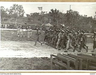 NEW GUINEA. 1943-11-20. NX8 LIEUTENANT GENERAL SIR LESLIE MORSHEAD KCB KBE CMG DSO ED, GENERAL OFFICER COMMANDING, NEW GUINEA FORCE (1) TAKING THE SALUTE FROM UNITS OF THE 18TH AUSTRALIAN INFANTRY ..