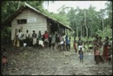 Men and boys in front of a building