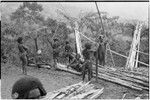 House-building for Rappaports: men prepare lumber for house frame