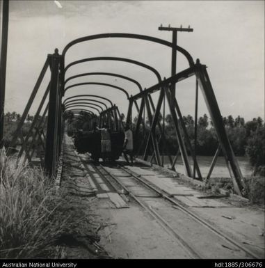 Taking a cane truck over the rail bridge