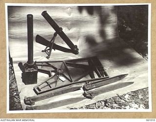 NEW GUINEA. 1943-11-24. DISMATLED JAPANESE SPIGOT MORTAR (ANTI-TANK). THIS EQUIPMENT HAS BEEN PREPARED FOR DEMONSTRATION PURPOSES BY THE COMMAND ROYAL ENGINEERS HEADQUARTERS, 9TH AUSTRALIAN ..