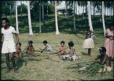 Sports - basket weaving race (coconut leaves): note Saulo, head Native Medical Orderly : Mapamoiwa Station, D'Entrecasteaux Islands, Papua New Guinea, 1957 / Terence and Margaret Spencer