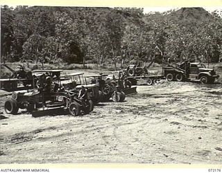 PORT MORESBY, NEW GUINEA. 1944-04-10. HEAVY ROAD MAKING EQUIPMENT UNDER REPAIR AT THE 1ST MECHANICAL EQUIPMENT WORKSHOP, AUSTRALIAN ELECTRICAL AND MECHANICAL ENGINEERS