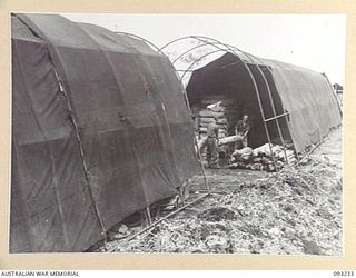 WEWAK AREA, NEW GUINEA, 1945-06-16. A GENERAL VIEW OF THE FIELD MAINTENANCE CENTRE, (ASSISTANT DIRECTOR OF ORDNANCE SERVICE DUMP), HQ 6 DIVISION