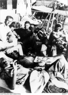 EMIRAU ISLAND, SURVIVORS FROM SHIPS SUNK BY GERMAN RAIDERS, THE AUXILIARY CRUISERS KOMET AND ORION, IN THE PACIFIC AREA, BEING EVACUATED FROM EMIRAU ISLAND IN THE BISMARCK ARCHIPELAGO, TO ..