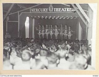 LAE AREA, NEW GUINEA, 1945-07-09. "STEPPING HIGH" PERFORMED BY THE AUSTRALIAN WOMEN'S ARMY SERVICE BALLET DURING THE STAGING OF THE 19 LINES OF COMMUNICATION AREA SIGNALS REVUE "OVER TO YOU". IT ..
