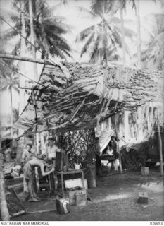 MILNE BAY, PAPUA. 1942-09. CAMOUFLAGED WORKSHOPS OF 101 INDEPENDENT BRIGADE GROUP WORKSHOPS IN THE MILNE BAY AREA