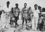 Takaroan pearl divers confer with Willard Bascom and chief Paniora, during the Capricorn Expedition