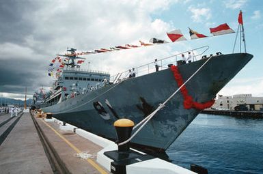 Its pennants waving in the wind, the visiting Chinese training vessel ZHENG HE sits tied up at the wharf