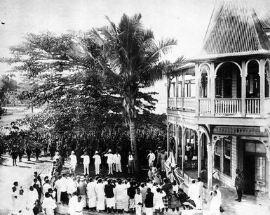 Raising of the Union Jack outside the courthouse in Apia, Samoa