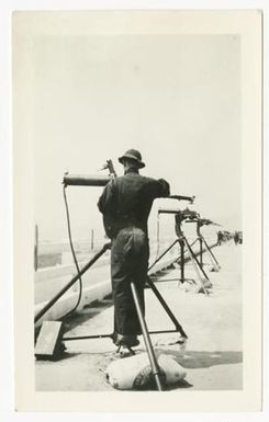 [Man Sets up Anti-Aircraft Gun]