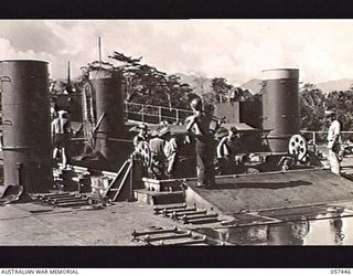 FINSCHHAFEN, NEW GUINEA. 1943-09-22. JEEPS OF THE FINSCHHAFEN FORCE COMING UP IN A LIFT TO THE TOP DECK OF AN LST (LANDING SHIP, TANK)