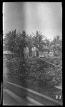 Two Europeans on rock wharf, possibly at Vella Lavella