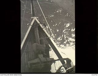 PORT MORESBY, PAPUA. C. 1944. CREW MEMBERS ON THE BOW OF A SAILING VESSEL USED BY THE RAAF RESCUE SERVICE