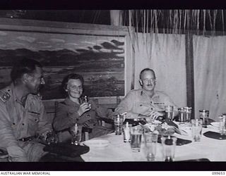 LAE, NEW GUINEA, 1946-01-24. LIEUTENANT-COLONEL M. F. BROGAN, STAFF OFFICER, ENGINEER (1) WITH A MEMBER OF THE AUSTRALIAN ARMY NURSING SERVICE (2) AND BRIGADIER E. L. SHEEHAN, BRIGADIER GENERAL ..