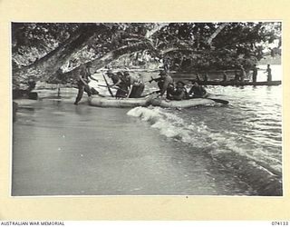 BLUP BLUP ISLAND, NEW GUINEA. 1944-06-19. MEMBERS OF A PATROL FROM THE 24TH INFANTRY BATTALION MOVING ASHORE FROM RUBBER DINGHYS AND A NATIVE CANOE TO INVESTIGATE RUMOURS OF A JAPANESE RADIO ..