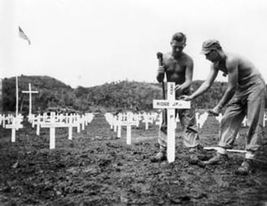 [Marines Placing Crosses for Fallen Personnel]