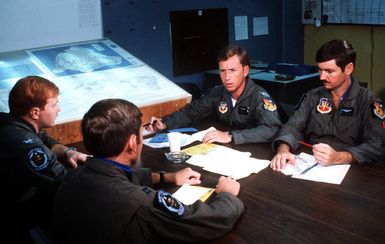 F-16 Fighting Falcon aircraft pilots hold a preflight briefing during exercise COPE ELITE '81. The pilots are from 428th Tactical Fighter Squadron, 474th Tactical Fighter Wing