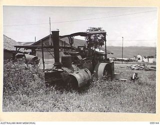 LAE, NEW GUINEA. 1945-11-20. A DERELICT STEAM ROLLER WHICH IS BELIEVED TO HAVE BEEN BROUGHT TO LAE FROM SINGAPORE