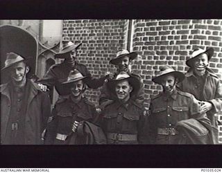 Kensington, Sydney, NSW. Group portrait of members of the New Guinea air Warning Wireless Company (NGAWW) taken at "Tich" Taylor's wedding. Left to right, back row: Bill Thompson; Terry Curley; ..