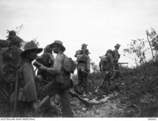 SATTELBERG AREA, NEW GUINEA. 1943-11-17. TROOPS OF THE 2/48TH AUSTRALIAN INFANTRY BATTALION READY TO MOVE OVER THE TOP TO ATTACK JAPANESE POSITIONS ON SATTELBERG. SHOWN ARE: SX7294 SERGEANT H. F. ..