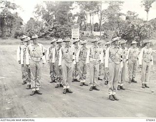 LAE, NEW GUINEA. 1944-09-21. PERSONNEL OF THE NEW GUINEA FORCE PROVOST COMPANY ON PARADE. IDENTIFIED PERSONNEL ARE:- SERGEANT D.M. SOLOMON (1); CORPORAL I.D. PORTER (2); CORPORAL G.M. CAMERON (3); ..