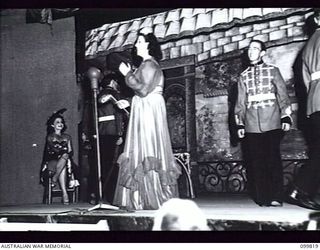 RABAUL, NEW BRITAIN, 1946-02-05. CORPORAL M L J. LENZ (JUANITA) SINGING DURING THE PERFORMANCE OF THE MUSICAL COMEDY "THE MAID OF THE MOUNTAINS" BY MEMBERS OF 6 ENTERTAINMENT UNIT, AUSTRALIAN ARMY ..