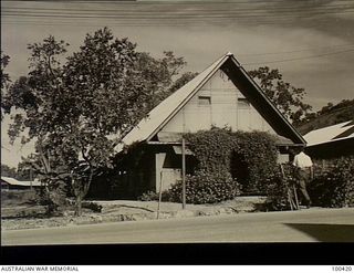 Port Moresby, New Guinea. 1944-05-09. Exterior of the Physiotherapy Department, 128th Australian General Hospital. A creeper is growing over the front entrance