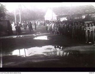 TERAPO, NEW GUINEA. 1943-09-16. EARLY MORNING LINE-UP FOR THE SELECTION OF NATIVE LABOUR AT THE TERAPO DOCKS