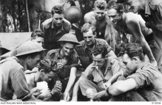 1943-10-06. NEW GUINEA. ATTACK ON LAE. THIS PLATOON OF A FAMOUS AUSTRALIAN BATTALION TOOK PART IN THE VICTORIOUS ADVANCE ON LAE. LEFT TO RIGHT - PTES. B. MACQUIRE OF JUNEE, N.S.W. W. ASPREY OF ..